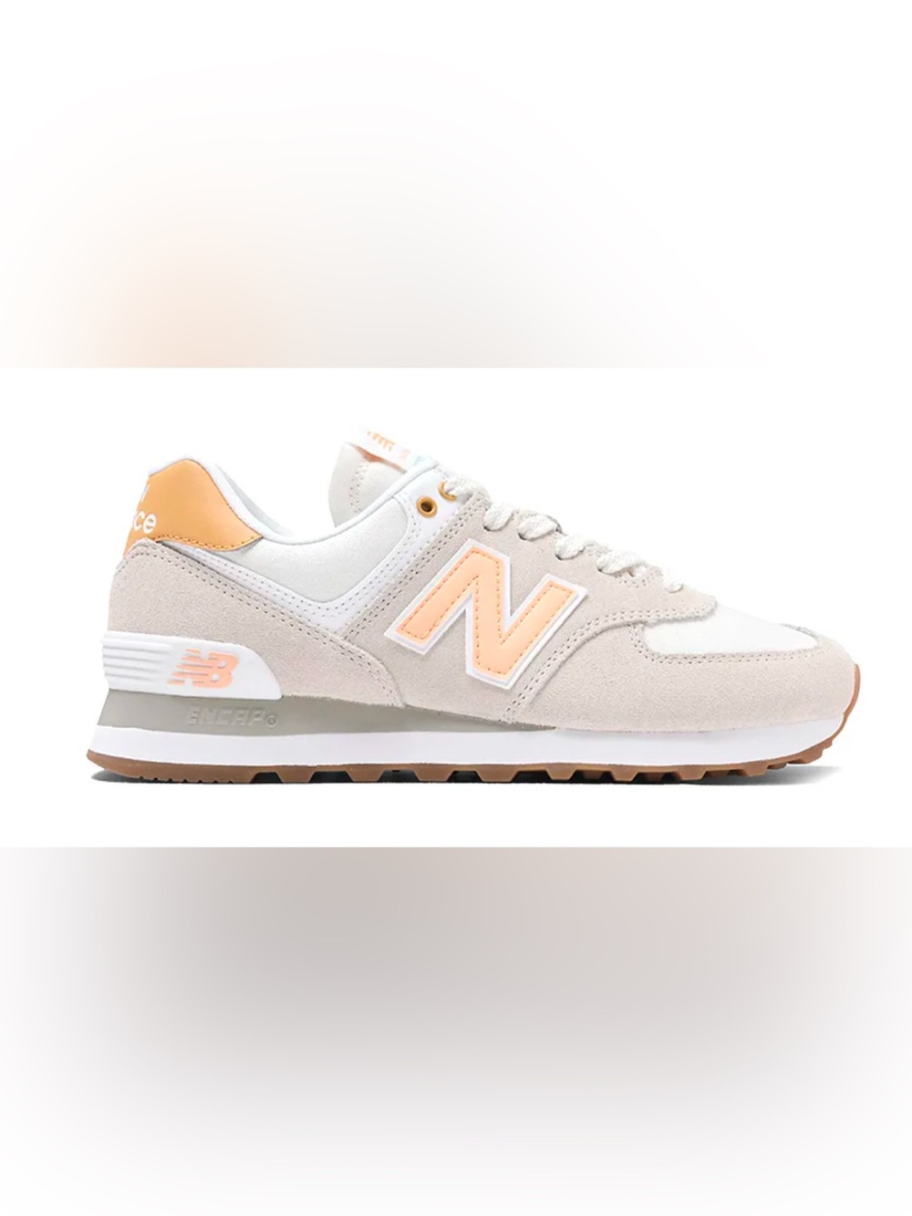 New Balance 574 in Timberwolf and Alpha Orange.